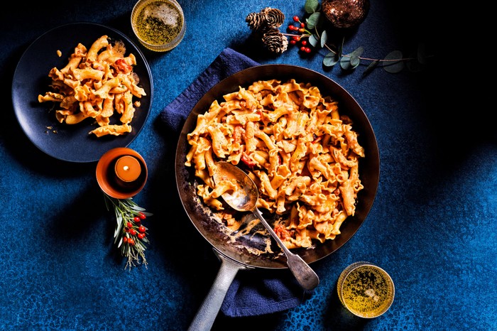 One-pot smoky pancetta pasta A one-pan pancetta pasta dish with a serving spoon in it