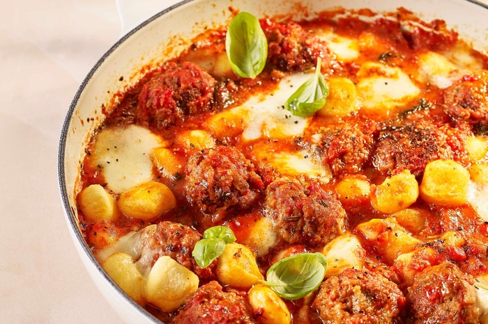 Meatball and gnocchi bake A one-pan meatball dish with drinks in the background