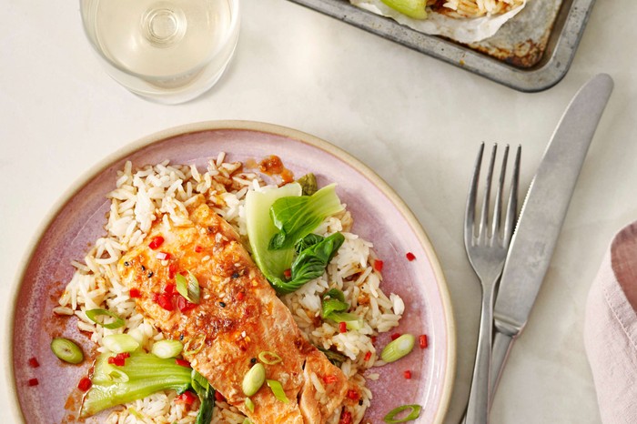 A fish parcel on top of vegetable rice