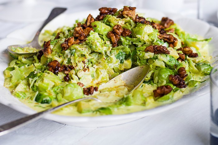 Creamed sprouts with brown buttered walnuts Creamed sprouts with brown buttered walnuts on a white serving platter