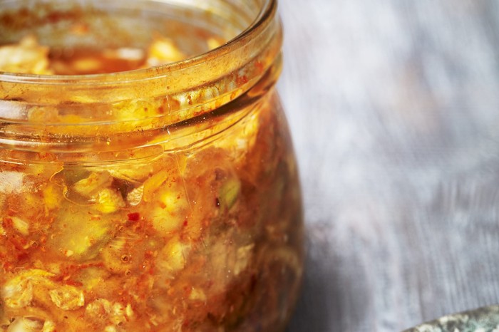 Fridge Drawer Kimchi A glass jar filled with pickled vegetables