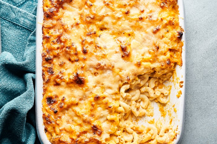 Butternut squash mac and cheese A white baking dish filled with baked macaroni and a golden cheese topping