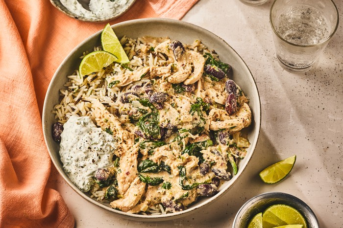 Tahini chicken chilli con carne with kidney beans A whole dish of tahini chicken chilli with dip on the side