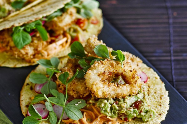 Taco Recipe with Fried Squid Rings and Kimchi Taco Recipe with fried squid rings and kimchi on a black rectangular plate