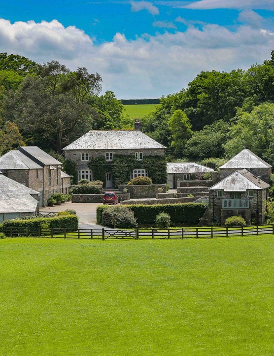 Foodie Hotels In Cornwall Best Places To Stay Farmhouse with bright green grass in front