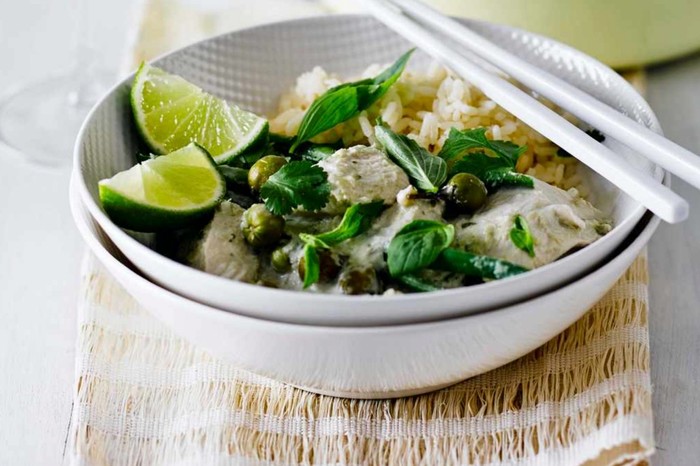 Thai Green Chicken Curry Recipe Thai green chicken curry in a bowl with a glass of wine