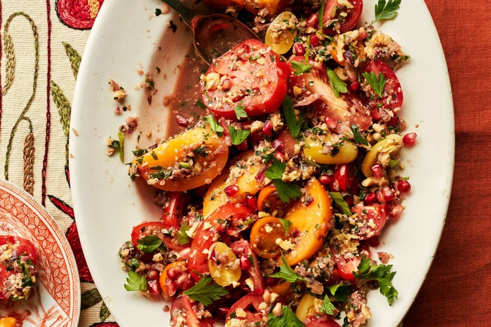 A large platter full of tomatoes