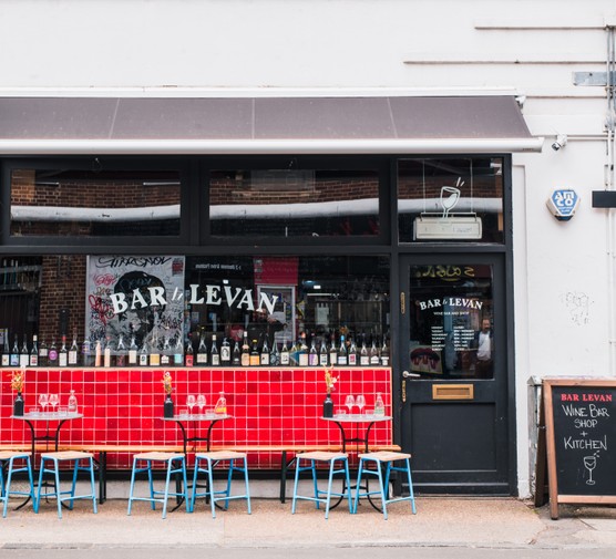 Bar Levan Peckham The front of Bar Levan in Peckham, with seats outside a red tiled wall