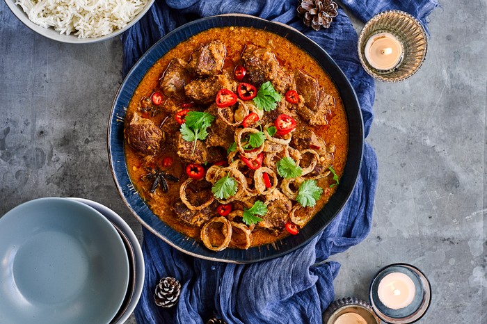 Beef shin Rendang Curry Recipe Pan of beef shin rendang curry topped with coriander and chilli