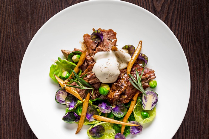 Slow-roasted leg of lamb with roasted salsify at Bernardi's, London Slow-roasted leg of lamb with roasted salsify brussel tops & bang cauda at Bernardi's, London