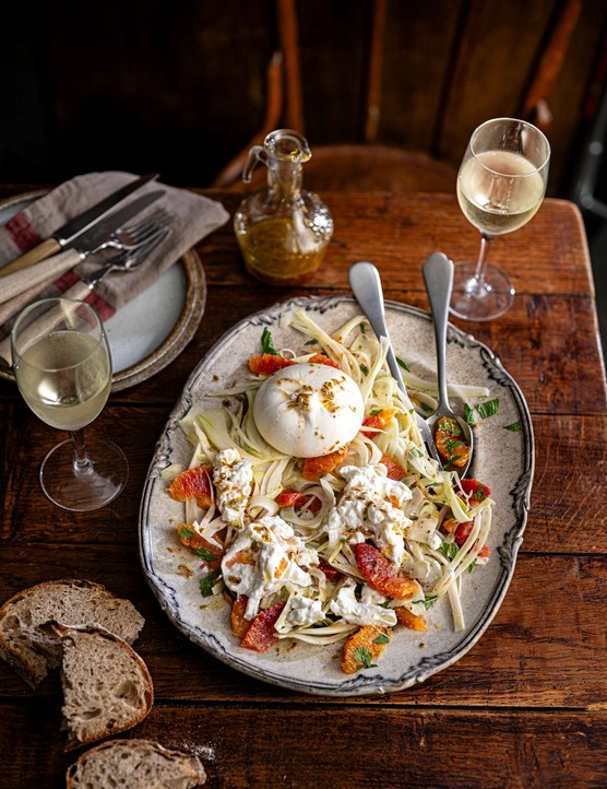 A sharing platter of blood orange, burrata and fennel salad with a whole burrata in the middle