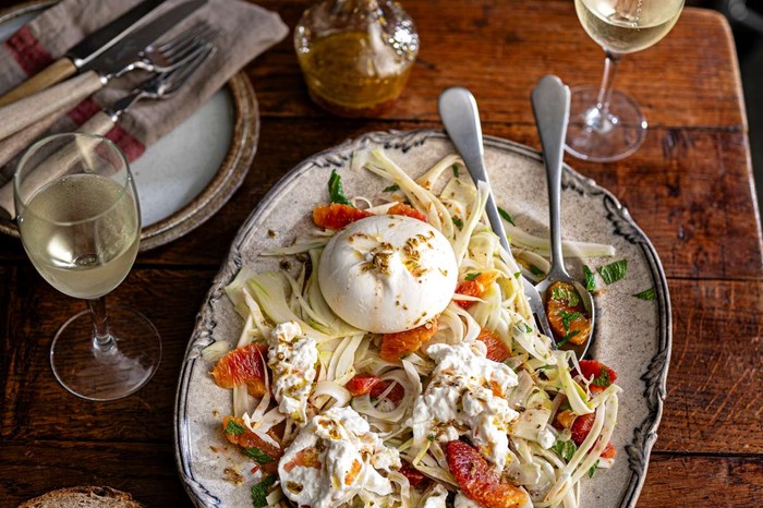 Blood orange, burrata and fennel salad A sharing platter of blood orange, burrata and fennel salad with a whole burrata in the middle