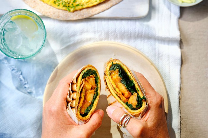 Cheesy bean omelette wraps An omelette wrap cut in half