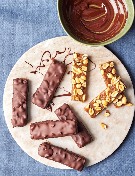 Plate of chocolate coated date and nut bars