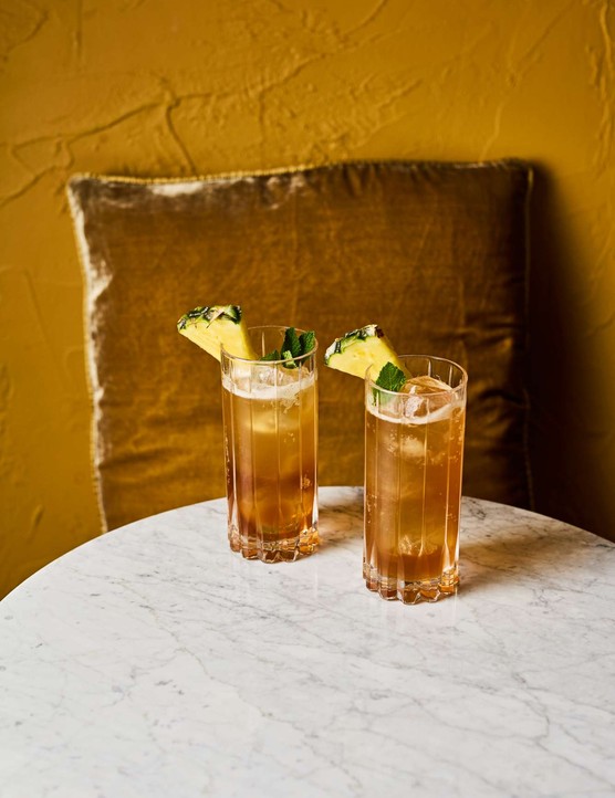 Two tall sherry cocktails on a table