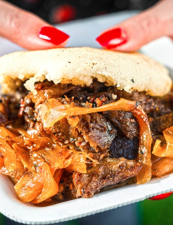 A street-food arepa with lamb and caramelised onion