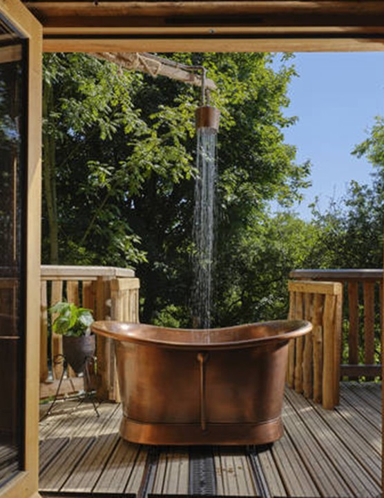 The UK hotel baths worth travelling for this autumn Copper bath on an outdoor patio