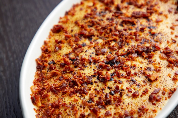 Tartiflette recipe a deep white dish of Tartiflette with a golden, crisp topping