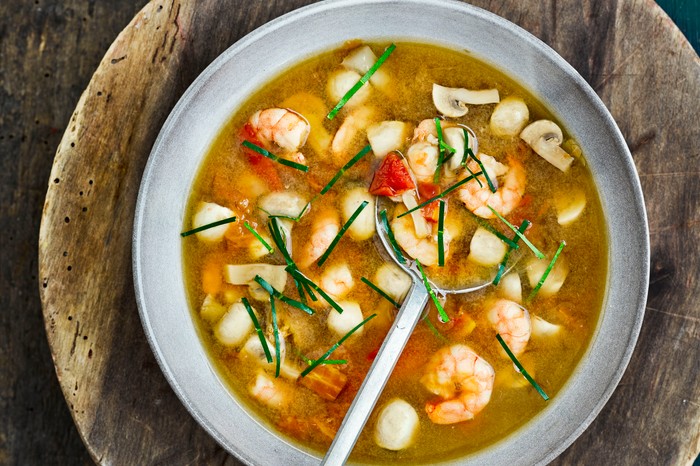 Tom Yum Soup with Prawns A bowl of tom yum soup with prawns