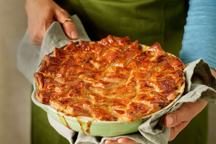 Cacio e pepe chicken patchwork pie Someone bringing a whole patchwork pie to the table