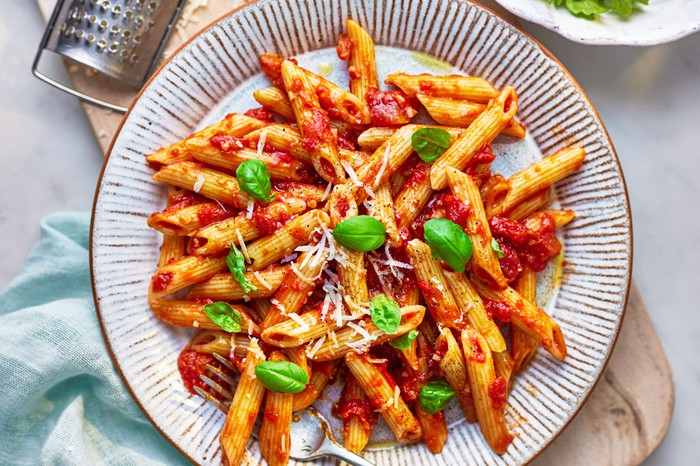 Penne arrabbiata Penne pasta in tomato sauce topped with parmesan and basil