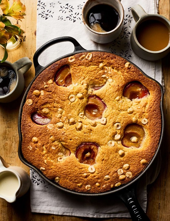 A whole skillet plum cake, ready to serve