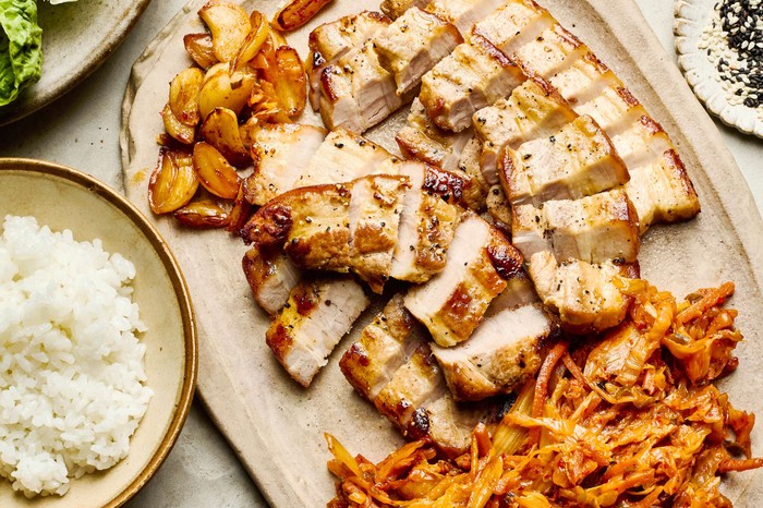 Korean pork belly with kimchi Pork belly cut into cubes and served on a platter