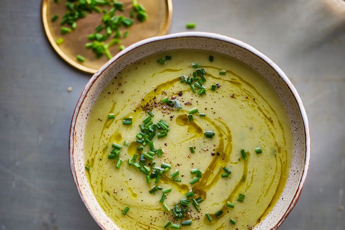 Roasted celery soup Bowl of roasted celery soup topped with olive oil and chopped chives