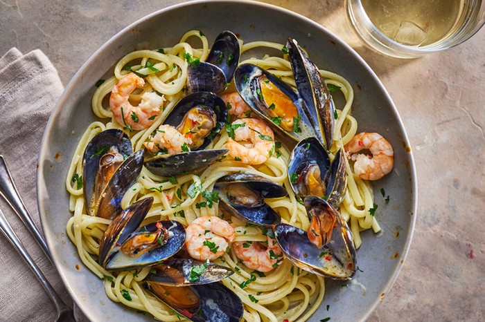 Seafood linguine Linguine in a bowl topped with prawns and mussels