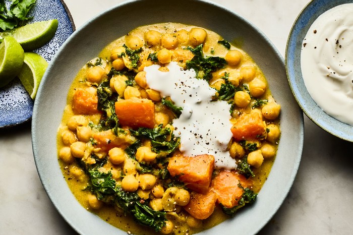 Slow cooker sweet potato, chickpea and coconut one-pot Slow cooker sweet potato, chickpea and coconut one-pot in a shallow bowl