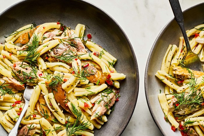 Two plates of smoked mackerel pasta