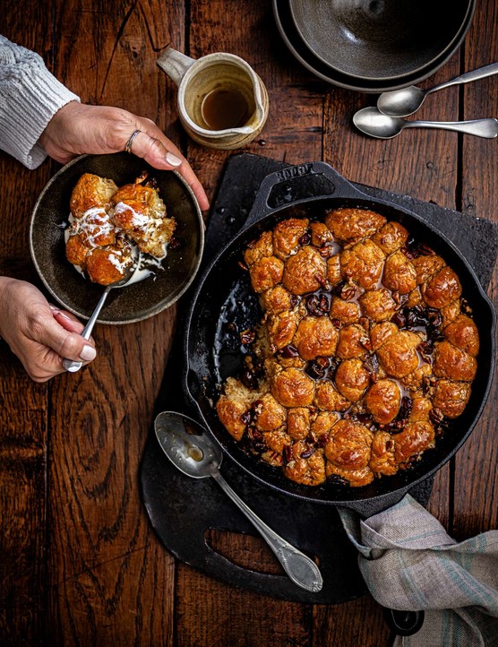 A whole monkey bread cob with one portion on the side