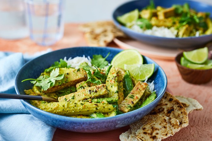 Tempeh curry Bowl of tempeh curry in focus at forefront of image with another out of focus in the background