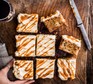 51 apple recipes Toffee apple cake with cream cheese icing sliced into 8 separate squares