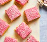 Tottenham Cake Recipe Squares of pink Tottenham cake on a board