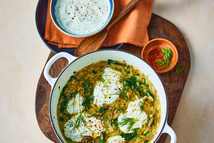 Vegan toasted orzo with dill yogurt Pot of orzo topped with yogurt and dill next to a bowl of yogurt