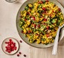 Winter veg pilaf Large bowl of rice topped with coriander and pomegranate seeds