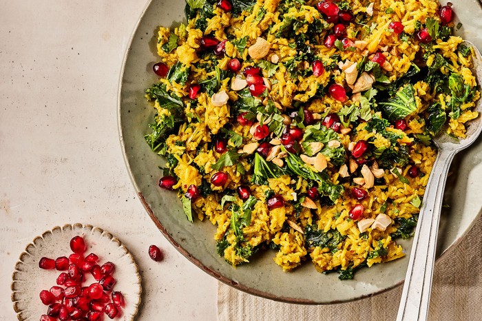 Winter veg pilaf Large bowl of rice topped with coriander and pomegranate seeds