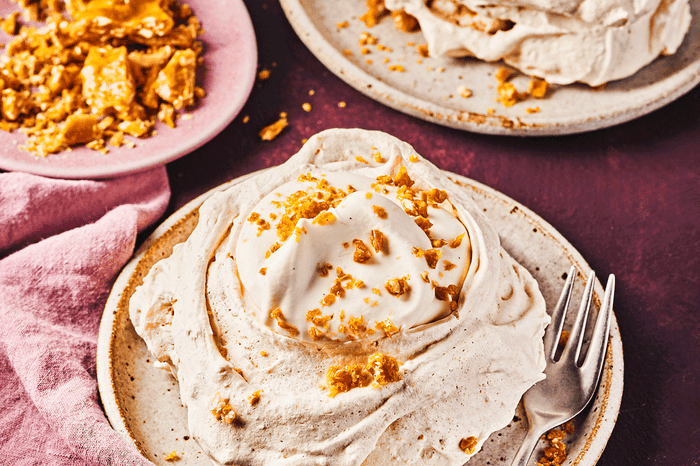 Hazelnut meringues with chantilly cream Two meringues with crunchy hazelnut brittle and chantilly cream on top