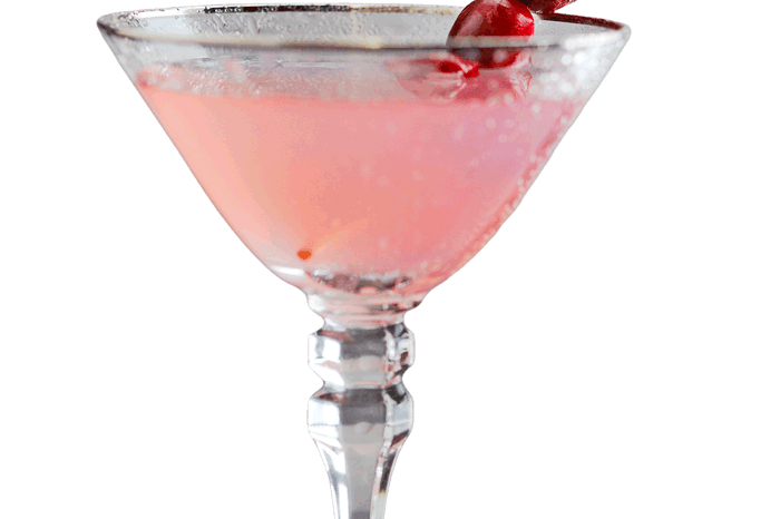 Cranberry gimlet Pink cranberry gimlet in a martini glass