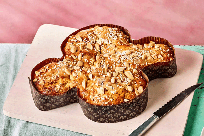 Italian Dove Cake Italian Easter cake in dove mould on a pink background
