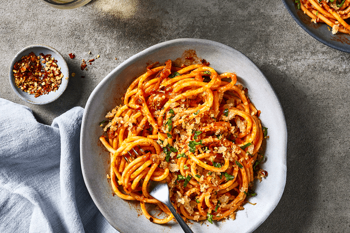 Anchovy pasta Bowl of anchovy spaghetti on a tabletop