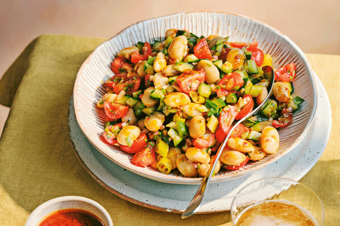 Summer butterbean salad Bowl with butterbean salad with cherry tomatoes, cucumber and red onion