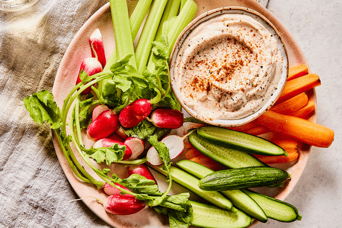 Taramasalata Taramasalata on a plate with chopped vegetable crudités
